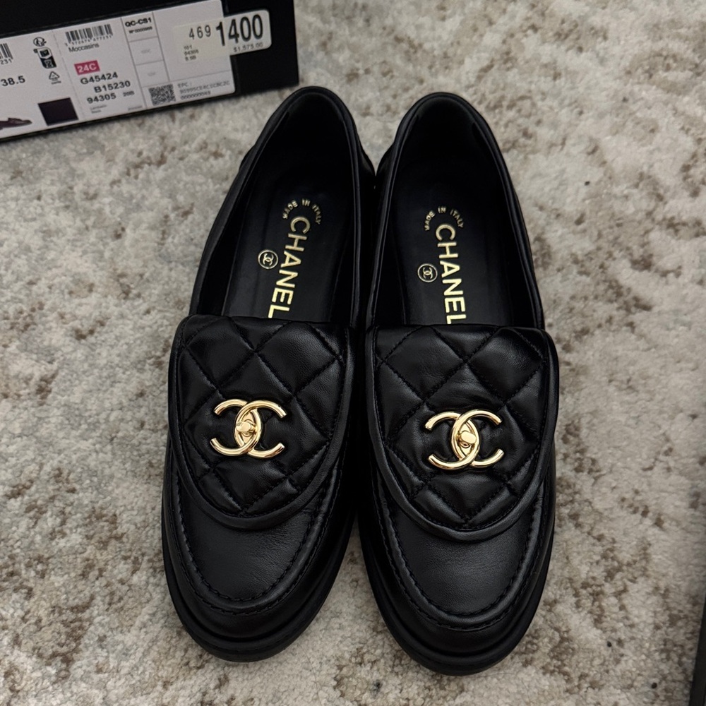 SOLD Chanel Black quilted Loafers with Gold Logo
